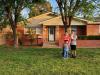 The Lopez Family in front of their newly purchased home.