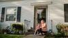Alicia and her son, Sy, outside their new home