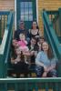 The LaRue Family sits on the steps of their new home